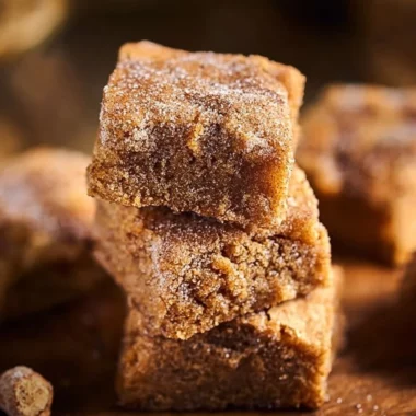 Freshly baked cinnamon sugar blondies on a plate
