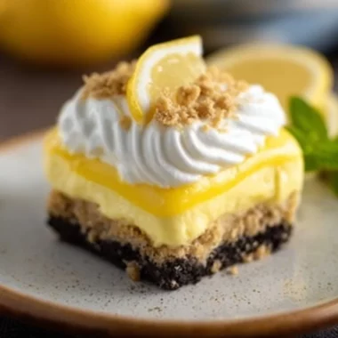 Delicious Oreo Lemon Dessert with creamy layers and Oreo crust.