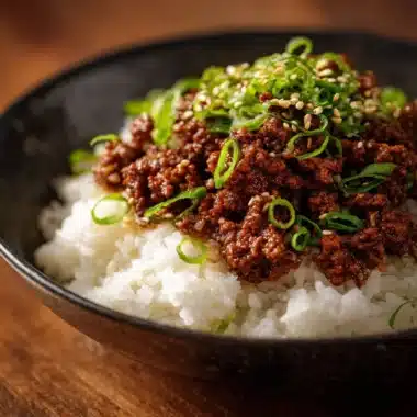 Korean Ground Beef Bowl topped with green onions and sesame seeds