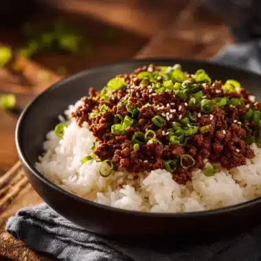 Korean Ground Beef Bowl with vegetables and rice served in a vibrant dish