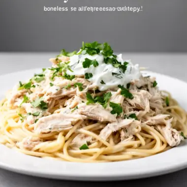 Creamy ranch chicken served on a plate with herbs and vegetables